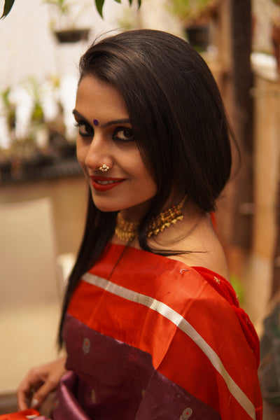 Light eminence purple chanderi handwoven silk saree with red mashru border. Presenting this unique purple tone chanderi silk handwoven saree with the red mashru border. The eknaliya buttas complete the saree look. Very soft and easy to drape.  Fabric- Pure silk  Colour-Purple and Red