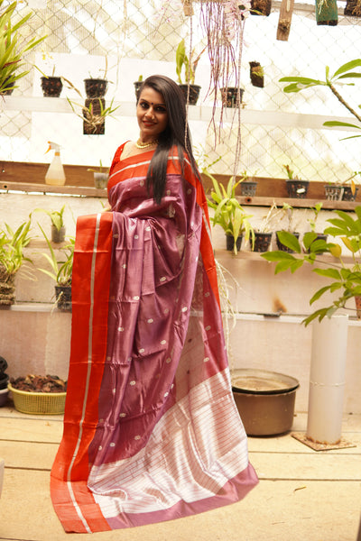 Light eminence purple chanderi handwoven silk saree with red mashru border. Presenting this unique purple tone chanderi silk handwoven saree with the red mashru border. The eknaliya buttas complete the saree look. Very soft and easy to drape.  Fabric- Pure silk  Colour-Purple and Red