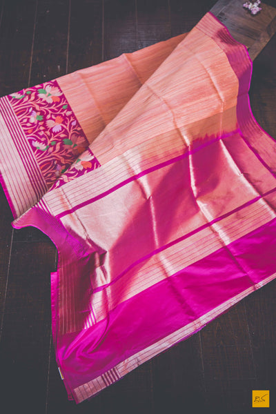Peach and Pink.  A banarasi saree with matka silk body and pure katan silk border. The saree is special for its lovely meenakari border. This trendy banarasi saree has a katan silk border, pallu and blouse. The lower border has lovely colourful jaal weaving in multiple colours.  This saree goes well for both formal and informal gatherings. Accessorise this saree with a gajra and pearl accessories to complete the look.