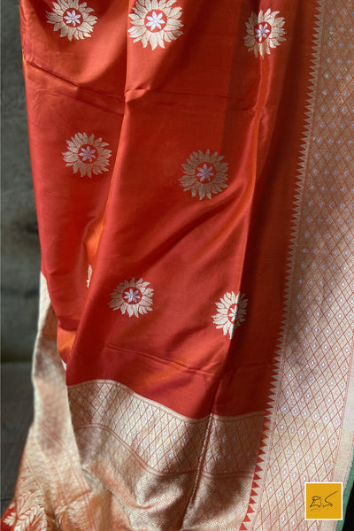 This is a gorgeous an orange-red banarasi katan silk handwoven dupatta with sona rupa buttas. New trend of Silk Dupatta designs, Silk Dupatta for artists, art lovers, architects, dupatta lovers, Dupatta connoisseurs, musicians, dancers, doctors, Silk dupatta, indian dupatta images, latest dupattas with price, only dupatta images, new Silk dupatta design.
