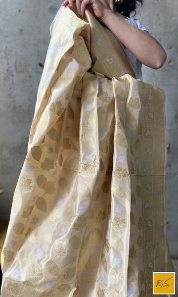 This is a gorgeous ivory gold banarasi katan silk handwoven dupatta with intricately woven buttas in sona rupa zari. New trend of Silk Dupatta designs, Silk Dupatta for artists, art lovers, architects, dupatta lovers, Dupatta connoisseurs, musicians, dancers, doctors, Silk dupatta, indian dupatta images, latest dupattas with price, only dupatta images, new Silk dupatta design.