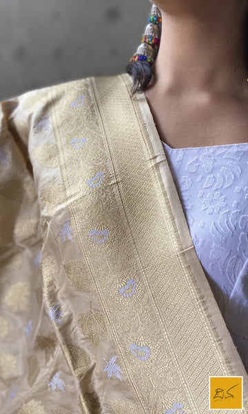 This is a gorgeous ivory gold banarasi katan silk handwoven dupatta with intricately woven buttas in sona rupa zari. New trend of Silk Dupatta designs, Silk Dupatta for artists, art lovers, architects, dupatta lovers, Dupatta connoisseurs, musicians, dancers, doctors, Silk dupatta, indian dupatta images, latest dupattas with price, only dupatta images, new Silk dupatta design.