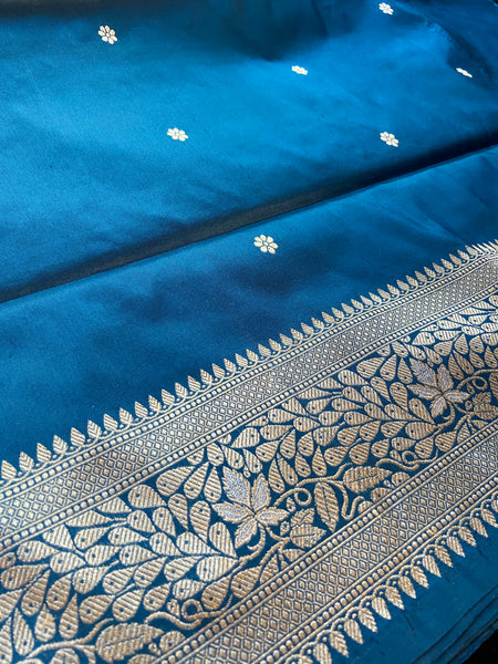Do you recall a traditional Banarasi weave belonging to your grandmother in this particular hue and similar pattern?  Presenting this blue banarasi saree with kadhwa buttas and meenakari border and pallu. Needless to say, very soft and easy to drape.   Fabric- Katan Silk