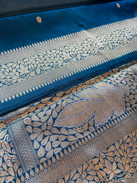 Do you recall a traditional Banarasi weave belonging to your grandmother in this particular hue and similar pattern?  Presenting this blue banarasi saree with kadhwa buttas and meenakari border and pallu. Needless to say, very soft and easy to drape.   Fabric- Katan Silk