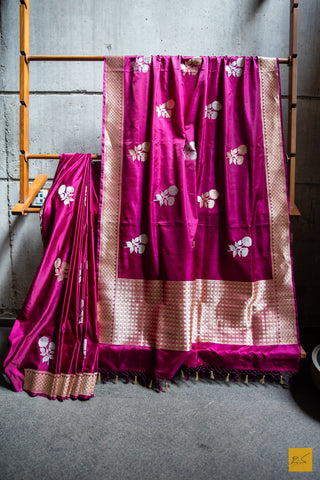 Experience the richness of heritage fashion with the luxurious Shobhita Sari. Handwoven with a blend of traditional Jamooni purple Banarasi and mashru silk, this sari is soft to the touch and flows beautifully. It features an intricate kadhwa buttas, a contemporary border on the blouse and pallu, and is perfect for making a sophisticated statement.  Fabric- Mashru Silk