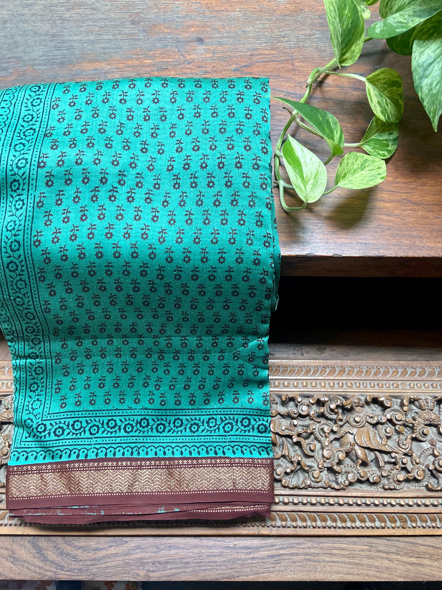 Crafted with a green and dark maroon combination, this elegant Green Bagh printed Maheshwari Saree is a timeless classic. The hand prints offer a unique touch while the Maheshwari silk cotton provides a luxurious look and feel for comfort. Bring timeless style to your wardrobe with this special piece.  Fabric- Silk Cotton
