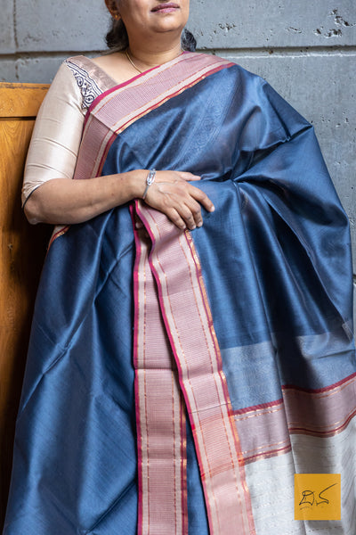 This stunning BLUE-MAGENTA MAHESHWARI SILK COTTON HANDWOVEN SAREE is a perfect combination of elegance and tradition. The high-quality fabric and handwoven craftsmanship make it suitable for both formal and casual occasions. With its vibrant colour and included blouse, this saree is sure to elevate your wardrobe.