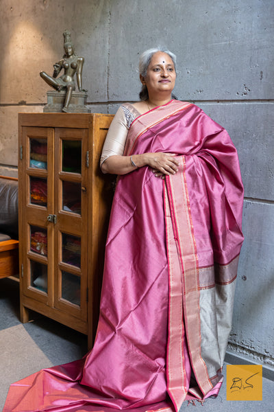 Discover the exquisite craftsmanship of the PINK-RED MAHESHWARI SILK COTTON HANDWOVEN SAREE. Made with the finest silk and cotton blend, this saree boasts a luxurious feel and stunning drape. Perfect for any occasion, this saree is a timeless addition to any wardrobe.