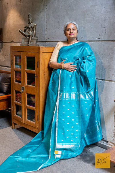 Indulge in the classic elegance of the Turquoise blue Maheshwari Silk Cotton Handwoven Saree. Made from a blend of silk and cotton, this handwoven saree features a beautiful turquoise blue color