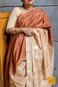 Elevate your style with our Beige-Brown Ombre Maheshwari Silk Cotton saree. This gorgeous saree boasts a stunning color fade, crafted from the finest Silk Cotton blend.