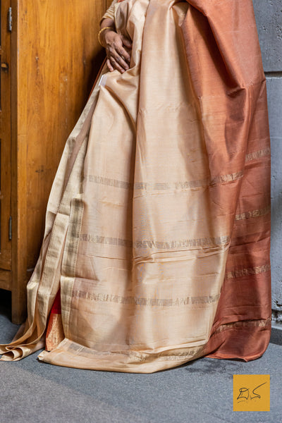 Elevate your style with our Beige-Brown Ombre Maheshwari Silk Cotton saree. This gorgeous saree boasts a stunning color fade, crafted from the finest Silk Cotton blend.