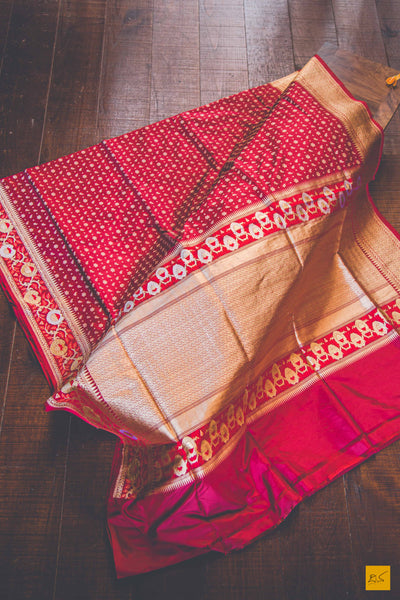 A beautiful katan silk banarasi handwoven sari with small star golden buttas. The saree has a golden Phulkari border And pallu with Meenakari. The meenakari is so exquisite that it makes the saree adorable. New trend of Banarasi Saree designs, Banarasi Saree for artists, art lovers, architects, saree lovers, Saree connoisseurs, musicians, dancers, doctors, Banarasi Katan silk saree, indian saree images, latest sarees with price, only saree images, new Banarasi saree design.