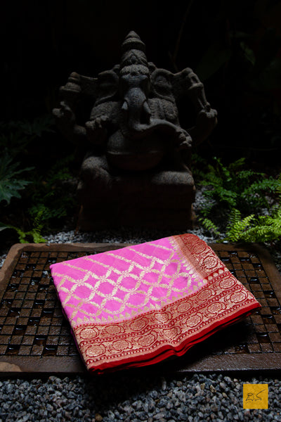 All set to be your loved one! Presenting this georgette banarasi saree in contrast shades of pink and red. A saree with zari jaal pattern suitable for weddings and festivals. What are you waiting for?