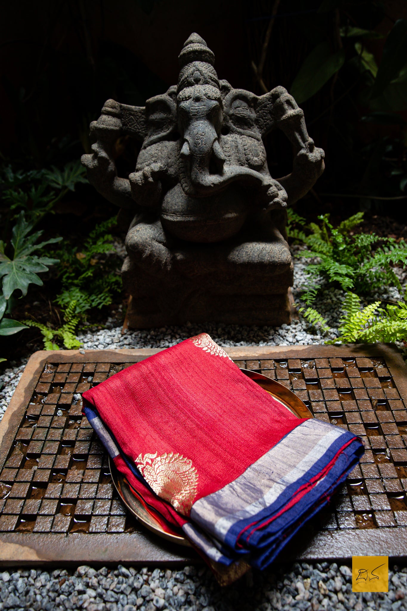 You are the LIGHT!  A banarasi tussar silk handwoven saree with kadhwa buttas. The saree is in maroon and  dark blue tones. A saree which drapes beautifully.