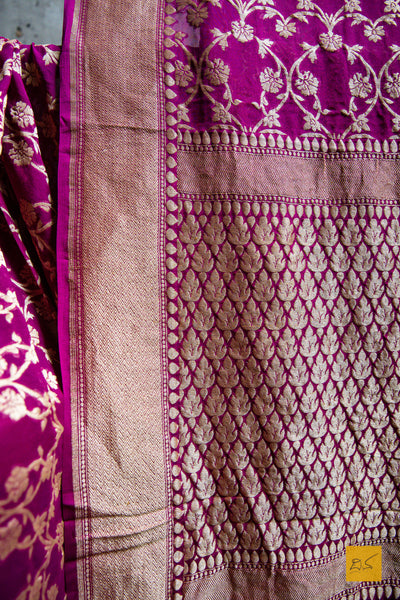Bow your head to this beaming beauty! A banarasi georgette saree in the shade of magenta. The saree has intricate zari woven jaal making it apt for a wedding reception, sangeeth , mehendi, house warming and of course for festivals too. Accessorise it with golden jhumkas and gajra to complete the look. 