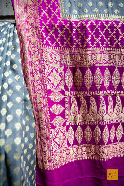 She is the successful one!  Presenting this lovely banarasi georgette saree in the shades of grey and pink. The sari has small buttas woven in cutwork style making it apt for this upcoming wedding and festive season. We would suggest minimal accessories. What will be your choice of accessories for this saree?