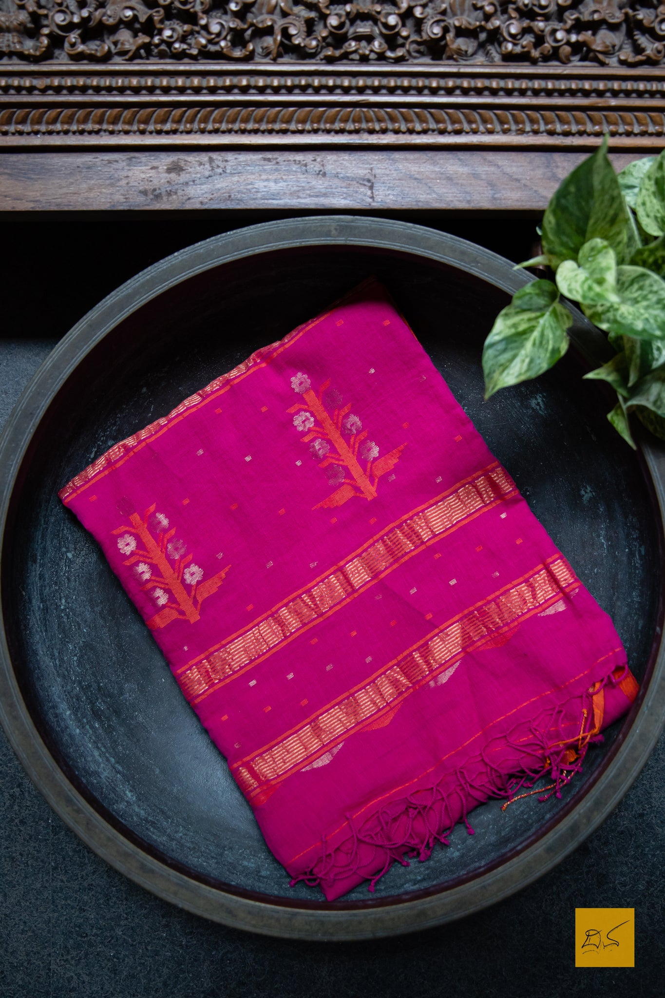 Suguna Hand spun Cotton Handwoven Jamdani Saree. A super soft handspun cotton saree with handwoven jamdani weave. This saree is perfect to drape the whole day very comfortably.  Fabric- Hand spun Cotton Colour- Pink-Orange Length- 6.5m