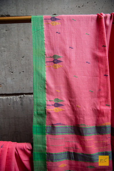 Sukrita Hand spun Cotton Handwoven Jamdani Saree. A super soft hand spun cotton saree with handwoven jamdani weave. This saree is perfect to be draped the whole day very comfortably.  Fabric- Cotton Colour-Pink Length- 6.5m