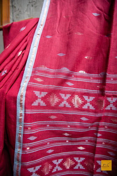 Sunaina Hand spun Cotton Handwoven Jamdani Saree. A super soft hand spun cotton saree with handwoven jamdani weave. This is a perfect saree to be draped the whole day very comfortably.  Fabric- Cotton Colour-Maroon Length- 6.5m