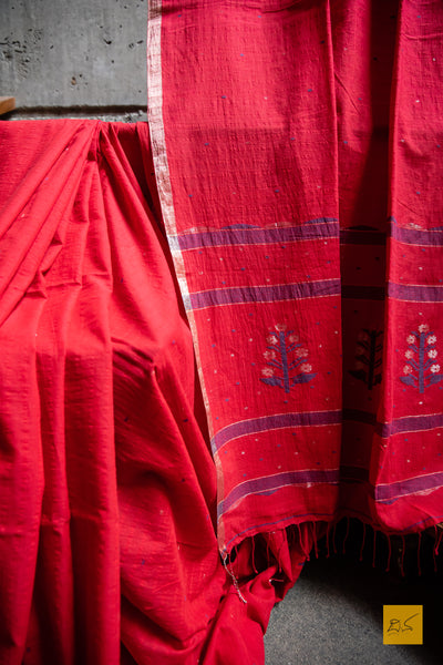 Pravaala Hand spun Cotton Handwoven Jamdani Saree. A super soft handspun cotton saree with handwoven jamdani weave. This saree is perfect to drape the whole day very comfortably.  Fabric-Hand spun Cotton Colour- Red Length- 6.5m