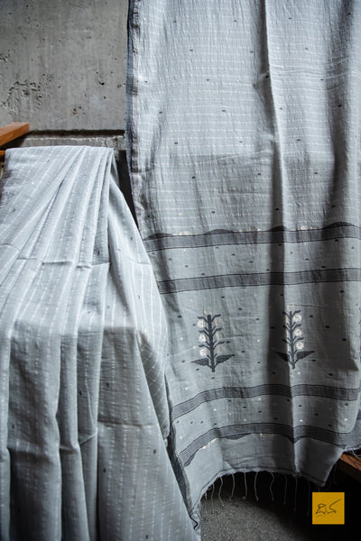 Sudeepta Hand spun Cotton Handwoven Jamdani Saree A super soft handspun cotton saree with handwoven jamdani weave. A saree perfect to be draped the whole day very comfortably.   Fabric-Hand spun cotton Colour- Grey Length- 6.5m