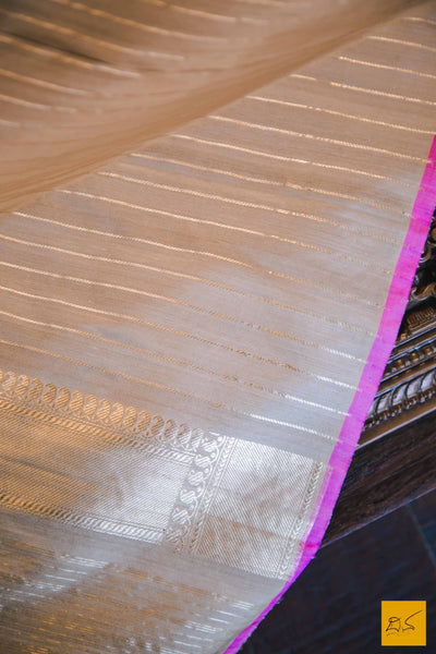 A magnificent banarasi tussar silk handwoven sari with sona and rupa traditional moghul notice woven in kadhwa motifs and pink slevegde. The blouse has woven zari stripes with the border New trend of Banarasi Saree designs, Banarasi Saree for artists, art lovers, architects, saree lovers, Saree connoisseurs, musicians, dancers, doctors, Banarasi Katan silk saree, indian saree images, latest sarees with price, only saree images, new Banarasi saree design.