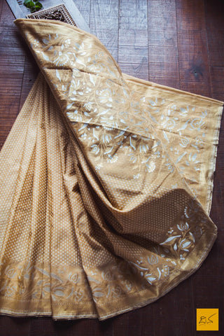 A lovely sheer brown banarasi pure kora silk sarees with small white buttas woven in classic banarasi cutwork style. The border and pallu has woven floral designs in Sona and Rupa zari makes this sari special. New trend of Banarasi Saree designs, Banarasi Saree for artists, art lovers, architects, saree lovers, Saree connoisseurs, musicians, dancers, doctors, Banarasi silk saree, indian saree images, latest sarees with price, only saree images, new Banarasi saree design.