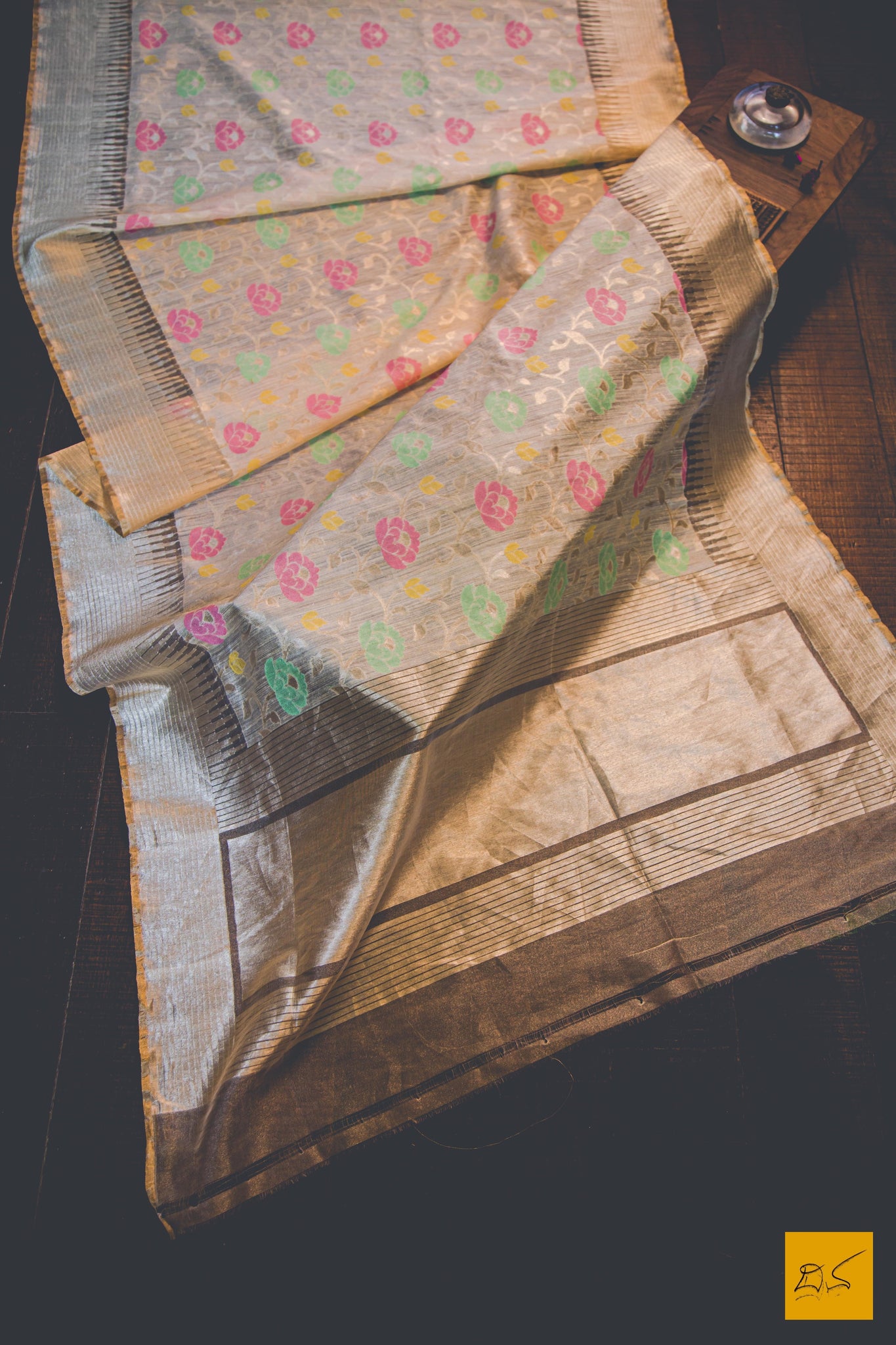 A beautiful tissue banarasi handwoven sari in dupion silk tilfi buttas in pink, green and yellow. The Beige body gives a soothing definition to the saree. Perfect for an informal or formal evening gathering. New trend of Banarasi Saree designs, Banarasi Saree for artists, art lovers, architects, saree lovers, Saree connoisseurs, musicians, dancers, doctors, Banarasi tissue dupion silk saree, indian saree images, latest sarees with price, only saree images, new Banarasi saree design.