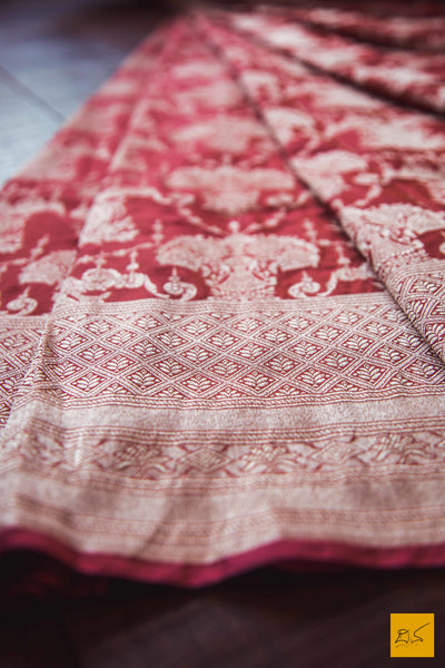 This is a beautiful katan silk banarasi sari with a red body and a unique zari jaal. New trend of Banarasi Saree designs, Banarasi Saree for artists, art lovers, architects, saree lovers, Saree connoisseurs, musicians, dancers, doctors, Banarasi Katan silk saree, indian saree images, latest sarees with price, only saree images, new Banarasi saree design.