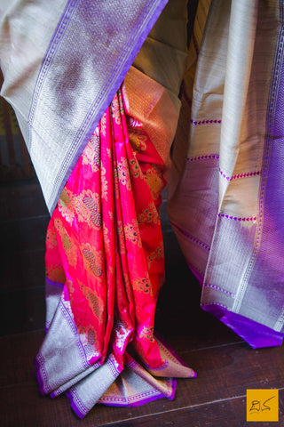 This is a gorgeous Banarasi silk handwoven Saree where the border is in purple colour. The pink part is of pure silk and buttas woven on it. The white part is of tussar silk in natural colour. The blouse is in purple with woven border. New trend of Banarasi Saree designs, Banarasi Saree for artists, art lovers, architects, saree lovers, Saree connoisseurs, musicians, dancers, doctors, Banarasi silk saree, indian saree images, latest sarees with price, only saree images, new Banarasi saree design.