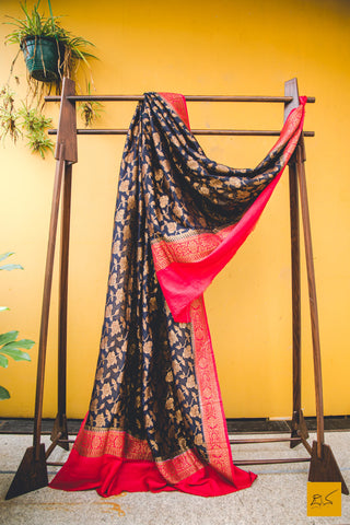 A classy combination of black and red coming together in this black and red banarasi munga silk dupatta, statement piece