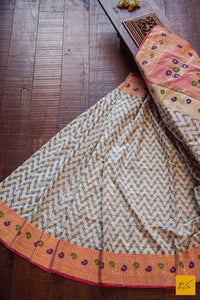This is a wonderful Banarasi Cotton handwoven Saree with an all over unique zig zag pattern woven in black. The kadhiyal border is of blush red colour. Very comfortable, soft and easy to drape. New trend of Banarasi Saree designs, Banarasi Saree for artists, art lovers, architects, saree lovers, Saree connoisseurs, musicians, dancers, doctors, Banarasi silk saree, indian saree images, latest sarees with price, only saree images, new Banarasi saree design.