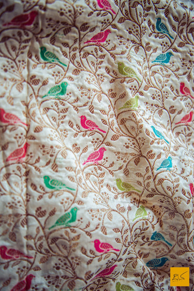 This is a gorgeous off white banarasi pure katan silk handwoven dupatta with intricate meenakari work. The design has intricate birds woven with meena work. New trend of munga Silk dupatta designs, munga Silk dupatta for artists, art lovers, architects, dupatta lovers, dupatta connoisseurs, musicians, dancers, doctors, munga Silk dupatta, indian dupatta images, latest dupattas with price, only dupatta images, new munga silk dupatta design.
