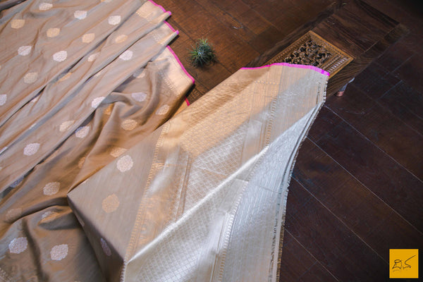 A magnificent banarasi tussar silk handwoven sari with sona and rupa traditional moghul notice woven in kadhwa motifs and pink slevegde. The blouse has woven zari stripes with the border New trend of Banarasi Saree designs, Banarasi Saree for artists, art lovers, architects, saree lovers, Saree connoisseurs, musicians, dancers, doctors, Banarasi Katan silk saree, indian saree images, latest sarees with price, only saree images, new Banarasi saree design.