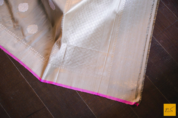 A magnificent banarasi tussar silk handwoven sari with sona and rupa traditional moghul notice woven in kadhwa motifs and pink slevegde. The blouse has woven zari stripes with the border New trend of Banarasi Saree designs, Banarasi Saree for artists, art lovers, architects, saree lovers, Saree connoisseurs, musicians, dancers, doctors, Banarasi Katan silk saree, indian saree images, latest sarees with price, only saree images, new Banarasi saree design.
