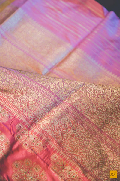 A beautiful katan silk banarasi handwoven sari with a peach body adorned with meenakari buttas. The zari border is the highlight of the saree. New trend of Banarasi Saree designs, Banarasi Saree for artists, art lovers, architects, saree lovers, Saree connoisseurs, musicians, dancers, doctors, Banarasi Katan silk saree, indian saree images, latest sarees with price, only saree images, new Banarasi saree design.