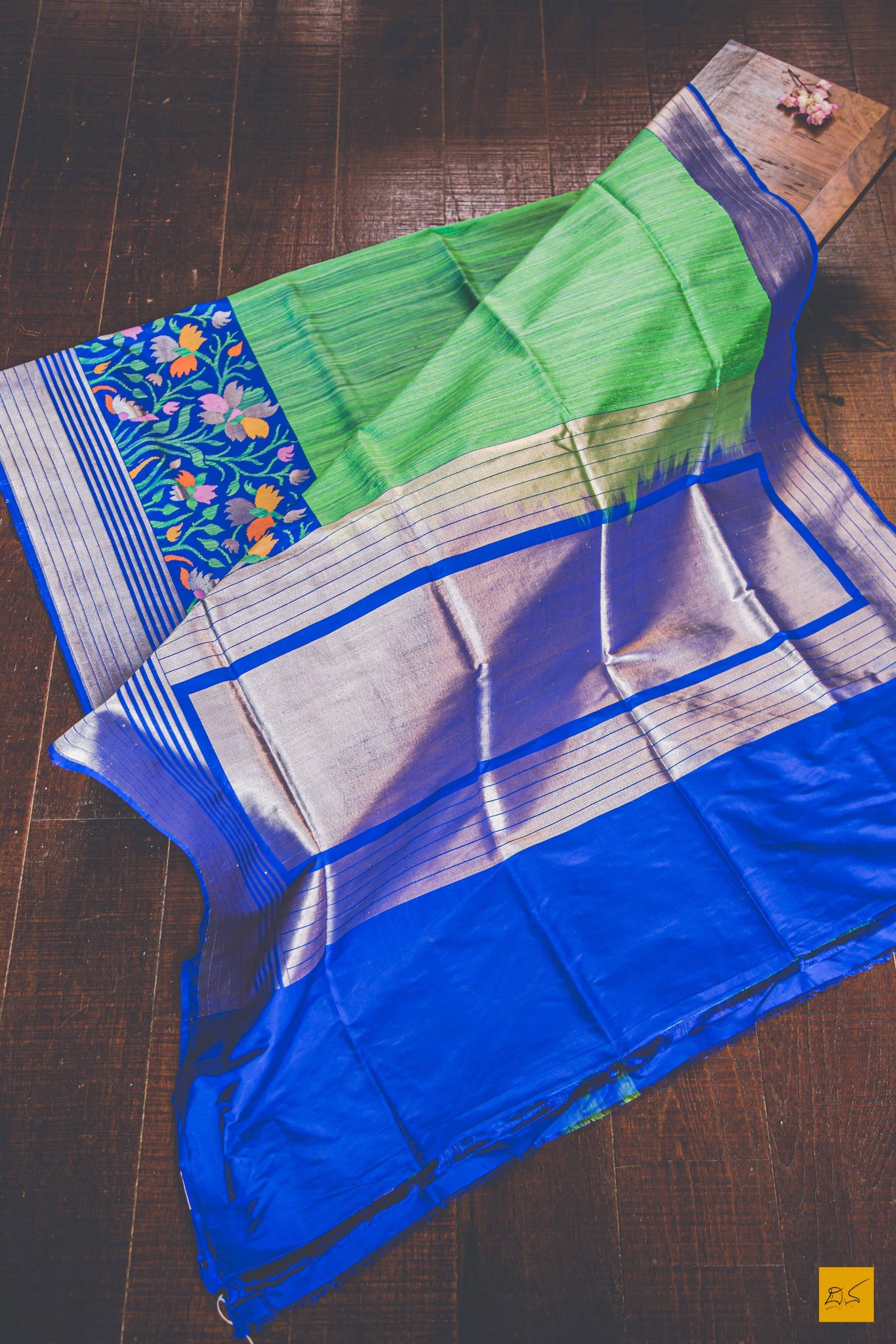 A banarasi saree with matka silk body and pure katan silk border. The saree is special for its lovely meenakaeri border. This trendy banarasi saree has a katan silk border, pallu and blouse. The lower border has lovely colourful jaal weaving in multiple colours.  This saree goes well for both formal and informal gatherings. Accessorise this saree with a gajra and pearl accessories to complete the look.