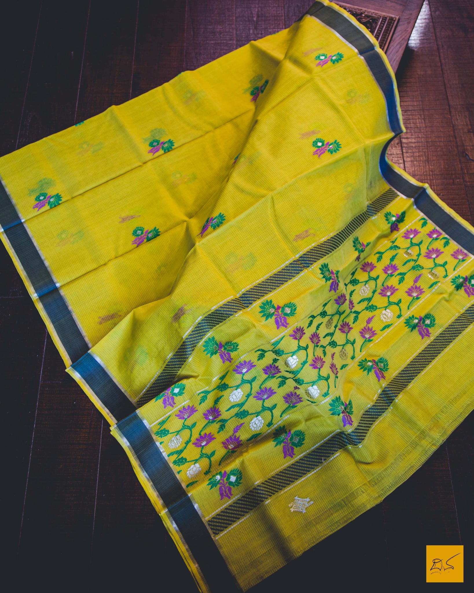 Sunshine, hope and happiness.  Experience these together in this yellow and grey real zari kota silk handwoven saree.