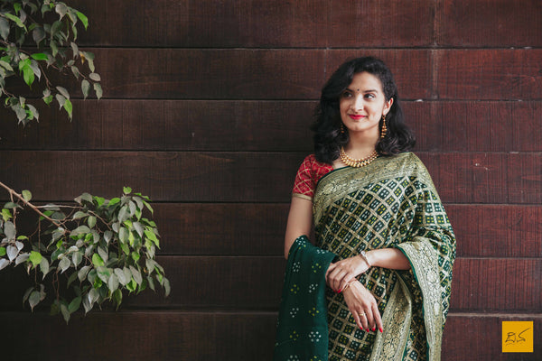 This is a gorgeous banarasi bandej saree with green colour body. The saree is plain and is accompanied with a lovely brocade blouse. New trend of bandej saree designs, bandej saree for artists, art lovers, architects, saree lovers, saree connoisseurs, musicians, dancers, doctors, bandej saree, indian saree images, latest sarees with price, only saree images, new bandej saree design.