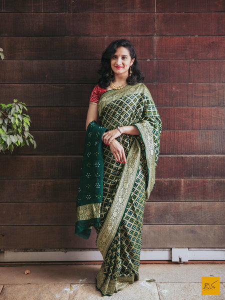 This is a gorgeous banarasi bandej saree with green colour body. The saree is plain and is accompanied with a lovely brocade blouse. New trend of bandej saree designs, bandej saree for artists, art lovers, architects, saree lovers, saree connoisseurs, musicians, dancers, doctors, bandej saree, indian saree images, latest sarees with price, only saree images, new bandej saree design.