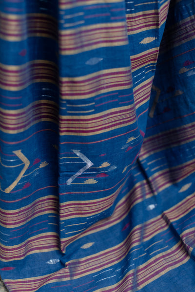 This Sukeerthi Hand spun Cotton Handwoven Jamdani Saree is perfect for a comfortable and stylish look. Crafted with hand-spun cotton and a classic Jamdani weave, this saree features an indigo shade and smooth handwoven finish for a rich, luxurious look. Enjoy a timeless style with modern comfort.