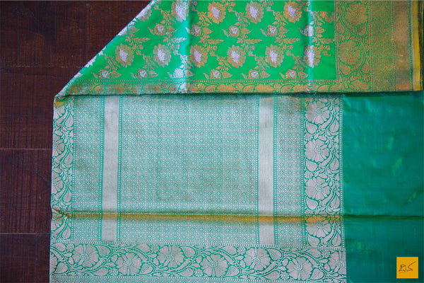A beautiful katan silk banarasi handwoven sari with a green body. New trend of Banarasi Saree designs, Banarasi Saree for artists, art lovers, architects, saree lovers, Saree connoisseurs, musicians, dancers, doctors, Banarasi Katan silk saree, indian saree images, latest sarees with price, only saree images, new Banarasi saree design.