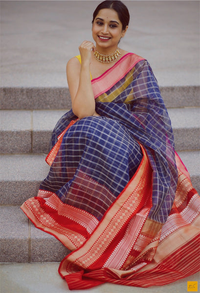 A wonderful banarasi kora silk handwoven sari. The body of the saree and the red blouse is woven in kora silk and the borders are in pink and red. A classic example of a kadhiyal saree. Tt is authentic Kadhiyal. New trend of Banarasi Saree designs, Banarasi Saree for artists, art lovers, architects, saree lovers, Saree connoisseurs, musicians, dancers, doctors, Banarasi silk saree, indian saree images, latest sarees with price, only saree images, new Banarasi saree design.