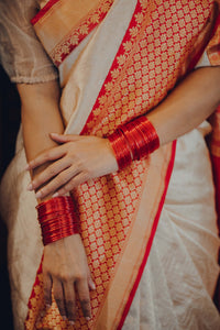 This is a beautiful banarasi katan silk zari tanchoi handwoven sari in gold and off-white banarasi with red contrast. New trend of Banarasi Saree designs, Banarasi Saree for artists, art lovers, architects, saree lovers, Saree connoisseurs, musicians, dancers, doctors, Banarasi Katan silk saree, indian saree images, latest sarees with price, only saree images, new Banarasi saree design.