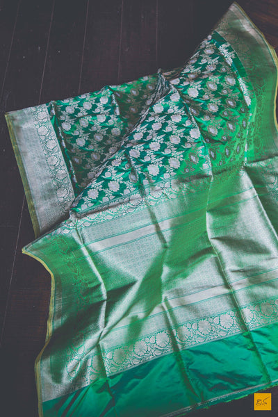 A beautiful katan silk banarasi handwoven sari with a green body. New trend of Banarasi Saree designs, Banarasi Saree for artists, art lovers, architects, saree lovers, Saree connoisseurs, musicians, dancers, doctors, Banarasi Katan silk saree, indian saree images, latest sarees with price, only saree images, new Banarasi saree design.