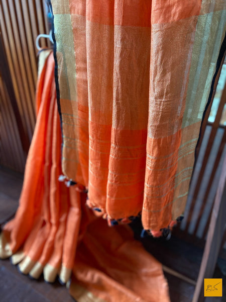 This is a gorgeous Linen handwoven Saree with a orange body. New trend of Saree designs, Saree for artists, art lovers, architects, saree lovers, Saree connoisseurs, musicians, dancers, doctors, linen saree, indian saree images, latest sarees with price, only saree images, new saree design.