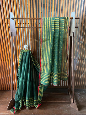 A lovely natural dye Emerald cotton Kota saree with subtle hints of red Kantha work. New trend of Saree designs, Saree for artists, art lovers, architects, saree lovers, Saree connoisseurs, musicians, dancers, doctors, silk saree, indian saree images, latest sarees with price, only saree images, new saree design.