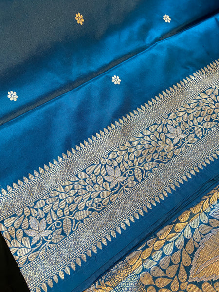 Do you recall a traditional Banarasi weave belonging to your grandmother in this particular hue and similar pattern?  Presenting this blue banarasi saree with kadhwa buttas and meenakari border and pallu. Needless to say, very soft and easy to drape.   Fabric- Katan Silk