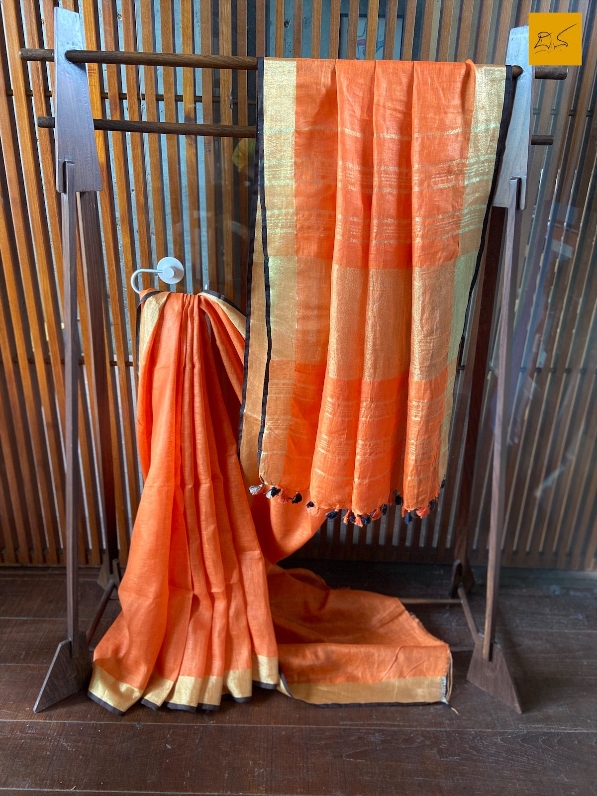 An orange linen saree which brings delight to the owner when draped. A perfect saree for work wear. Look gorgeous in this saree by pairing it with a printed or brocade blouse. This is a gorgeous Linen handwoven Saree with a orange body. New trend of Saree designs, Saree for artists, art lovers, architects, saree lovers, Saree connoisseurs, musicians, dancers, doctors, linen saree, indian saree images, latest sarees with price, only saree images, new saree design.