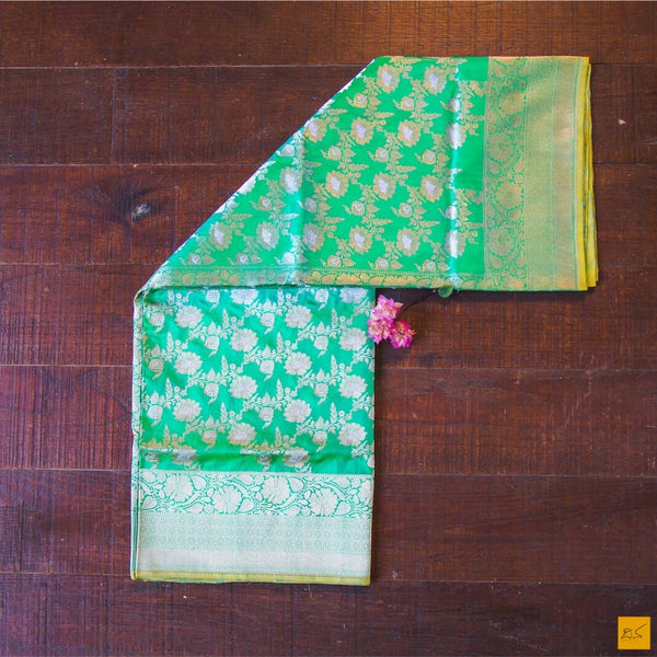 A beautiful katan silk banarasi handwoven sari with a green body. New trend of Banarasi Saree designs, Banarasi Saree for artists, art lovers, architects, saree lovers, Saree connoisseurs, musicians, dancers, doctors, Banarasi Katan silk saree, indian saree images, latest sarees with price, only saree images, new Banarasi saree design.